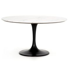 an oval marble table with black base