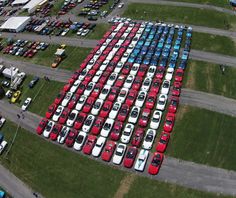 an aerial view of a parking lot full of cars