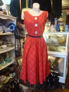 "This is a red and blue cotton plaid full skirt dress from the 1950's or early 1960's. It features a scoop neckline with 3 large faux mother of pearl buttons don the front. There is a navy blue vinyl belt with bow in front. This dress opens o the side with a well working metal zipper. The original hang tag is here. Label is from \"Modern Classics\". All in excellent, unworn condition! Comes from a smoke free home. Measurements: Bust: 40\" Waist: 28\" Hip: Full Bodice Depth: 17.5\" Waist to hem: Vintage Sleeveless Plaid Cotton Dress, Vintage Plaid A-line Dress, Vintage A-line Plaid Dress, 1950s Plaid Summer Dresses, 1950s Style Plaid Summer Dresses, Vintage Lined Plaid Dress, 50s Outfits, Heavy Winter Coat, Full Skirt Dress