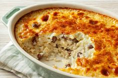 a casserole dish filled with rice and meat