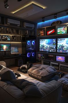 a living room filled with lots of furniture and flat screen tvs mounted to the wall