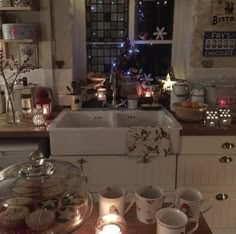 a kitchen filled with lots of food and candles