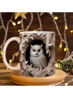 an owl is sitting in a carved coffee mug