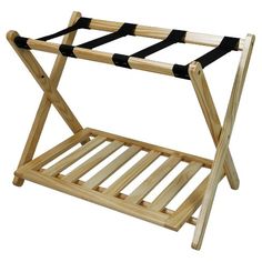 a wooden rack with black straps on it