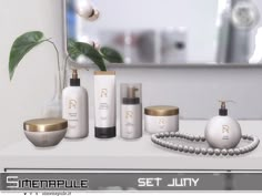 an assortment of skin care products displayed on a countertop in front of a mirror