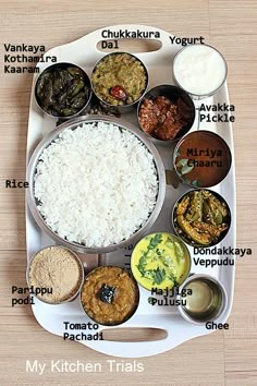 a white tray topped with lots of different types of food