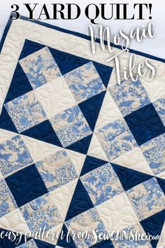 a blue and white quilt with the words, 3 yard quilt mosaic tiles