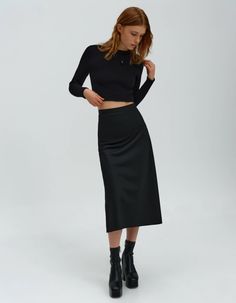 Wool midi-length skirt with hip fit and invisible zip closure. Supplied in black and brown colors. Match this skirt with fitted-waist cardigan or ivory viscose shirt from this collection. high waist A-line design mid-lenght 100% woolModel is 175cm/5'9'' and wearing - S size