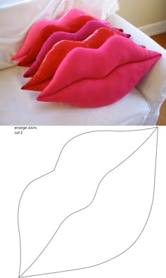 an image of a bed with pink sheets and pillows on it's headboard