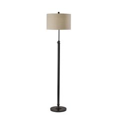 a black floor lamp with a beige shade on it's side and a white background