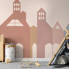 a child's room with a teepee tent and toys in front of it