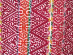 red and white fabric with different designs on it