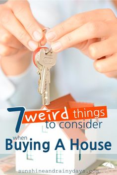 a person holding a house key with the words 7 weird things to consider when buying a house