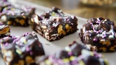 chocolate and sprinkles are arranged on a white platter, ready to be eaten