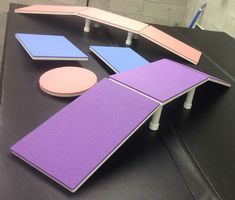 a table with several pieces of furniture on it, including a ping pong paddle