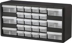 an organized drawer with plastic bins on the bottom and white drawers below it, against a white background