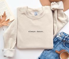 Embrace your passion for movement with our "Always Dance" sweatshirt. Perfect for dancers and dance enthusiasts, this cozy and stylish sweatshirt serves as a reminder to keep dancing through life. Whether you're warming up in the studio, heading to rehearsal, or enjoying a casual day out, this sweatshirt is a perfect fit for any occasion. It makes a great gift for dance lovers, friends, family, or a special treat for yourself. Let your love for dance shine with this must-have addition to your wa Relaxed Fit Crew Neck Top For Dance, Fitted Long Sleeve T-shirt For Dance, Casual Tops For Dance In Fall, Casual Tops For Fall Dance, Crew Neck Sweatshirt For Dance In Fall, Fall Dance Cotton Sweatshirt, Casual Letter Print Sweatshirt For Dance, Cotton Sweatshirt For Dance In Fall, Cotton Crew Neck Sweatshirt For Dance Class