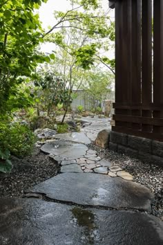 a stone path in the middle of a forest