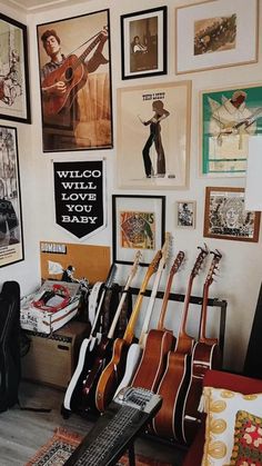 a room filled with guitars and pictures on the wall