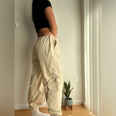 Asos Cargo Pants - Size Us 8 Like New! - No Tags But Never Worn - Cream,Tan Color Great Basic To Go With Any Fit - Cinched Waist And Bottoms Which Are Adjustable Cream Utility Bottoms With Cargo Style, Cream Utility Cargo Bottoms, Cream Utility Cargo Style Bottoms, Beige Utility Bottoms With Elastic Waistband, Cream Cotton Utility Bottoms, Beige Bottoms With Cargo Pockets And Loose Fit, Beige Long Pants With Side Pockets, Casually Loose-fit Cream Bottoms, Cream Cotton Cargo Bottoms