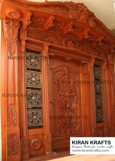 an ornate wooden cabinet with intricate carvings on the front and side doors, made out of wood