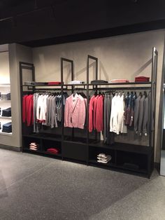 a clothing rack with clothes hanging on it