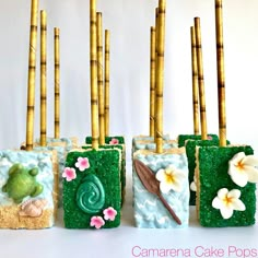 there are four cakes made to look like rice krispy treats with flowers on them