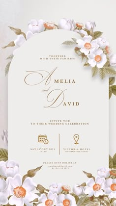 an elegant wedding card with flowers and leaves