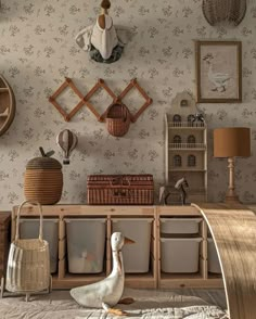 a duck sitting on top of a bed next to a wooden shelf filled with baskets