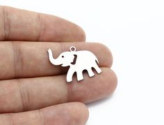 Stainless Steel Elephant Pendant, Elephant Charm, Elephant Bracelet, Animal Jewelry, Necklace Findings, Steel Findings Material ; Stainless Steel Size        ; 19x29mm Color      ; Raw Hole Size ; 1.40 mm  Thickness ; 0.80mm Quantity  ; Options  Nickel Free  Lead_Free Our products are our own production. Please contact me for other questions. Please click on the link below to view our other raw stainless products. https://www.etsy.com/shop/shinymetaljewelry?ref=seller-platform-mcnav&section_id=4 Elephant Bracelet, Elephant Pendant, Elephant Charm, Animal Jewelry, Jewelry Necklace, Elephant, Accessory Gift, Electronic Accessories, Purses And Bags