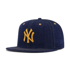 New Era Cap 59Fifty fitted hat for the New York Yankees using denim material and featuring 1952 World Series side patch. The use of Light Navy Denim cotton on this fitted is beautifully combined with Temple Gold stitching between the panels and eyelets, producing a look that’s not unlike actual jean pants. The perfect contrasting elements are added via the 1952 World Series side patch and brightly colored rear logo, which is also flat-embroidered for a supremely premium look. As far as denim hat Custom Fitted Hats, Jean Pants, Denim Hat, Dream Style, New Era Cap, Denim Cotton, New Era 59fifty, Personal Marketing, World Series