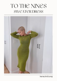 a woman in a green sweater dress leaning against a door with her hands on her head