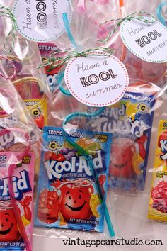 some kind of candy bag with tags on it and two bags of kool - aid