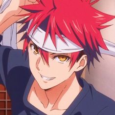 an anime character with red hair wearing a blue shirt and holding a knife over his head