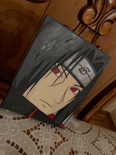 a painting of an anime character on a table