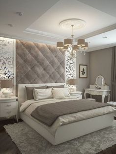 a bedroom with a large bed and white furniture