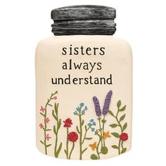 a ceramic jar with flowers on it that says sisters always understand