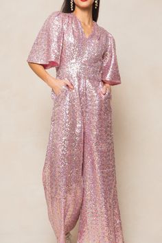 Get ready to sparkle and shine in our Bejeweled Jumpsuit! Made from pink sequin fabric, this women's jumpsuit features a flattering v-neckline and flirty short bell sleeves. The wide leg pants come equipped with convenient pockets and the exposed back zipper adds an extra touch of glam. Fully lined for added comfort. Ivy City Women's Bejeweled Jumpsuit Pink | Size: Medium Short Bell Sleeves, Jumpsuit Pink, Women's Jumpsuit, Thanksgiving Dress, Girls Holiday Dresses, City Woman, White Dress Party, Pink Jumpsuit, Matching Family Pajamas