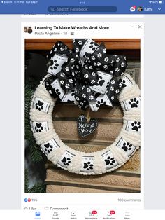 a dog themed wreath with paw prints on it