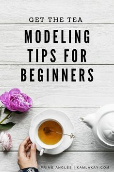 a person holding a cup of tea next to a white table with pink flowers on it and the words, get the tea modeling tips for beginners