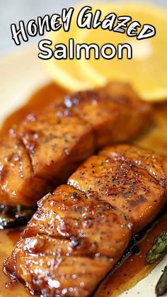 honey glazed salmon on a plate with asparagus