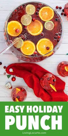 an easy holiday punch recipe with oranges, cranberries and lemons on the side