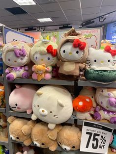 hello kitty stuffed animals are on display in the store for $ 5 95 per pound