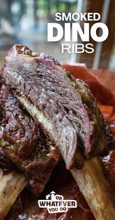 a close up of a steak on a plate with text that reads smoked dino ribs for whatever you do