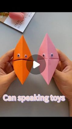 two hands holding up origami toys with the words can speaking toys on them