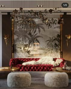 a living room with red couches and chandeliers hanging from the ceiling above them