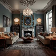 a living room filled with furniture and a fire place under a chandelier hanging from the ceiling