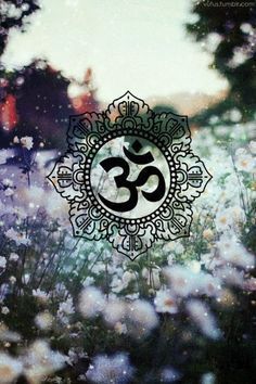 an image of a flower with the word om in it's center surrounded by white flowers