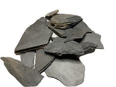 a pile of black slate chips on a white background