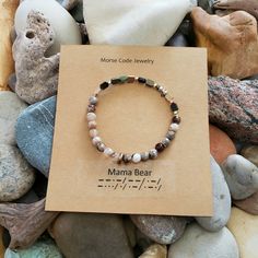 This Beautiful Bracelet Spells Out "Mama Bear" In Morse Code Through A Sequence Of Dots And Dashes. Handmade In My Michigan Studio, This Bracelet Is One Of A Kind, Crafted With Polished Fire Agates And Hematite. Add A Drop Of Your Favorite Essential Oil For An Aromatherapy Bracelet. Perfect For Mother's Day. Tags Yoga Jewelry, Aromatherapy, Agates, Handmade, Artisan Jewelry, Boho, Minimalist, Earth Tones, Metallic Adjustable Spiritual Bracelets As Gifts For Mom, Spiritual Bracelets For Mother's Day Gift, Aromatherapy Bracelet, Morse Code Bracelet, Boho Minimalist, Fire Agate, Morse Code, Yoga Jewelry, Jewelry Boho